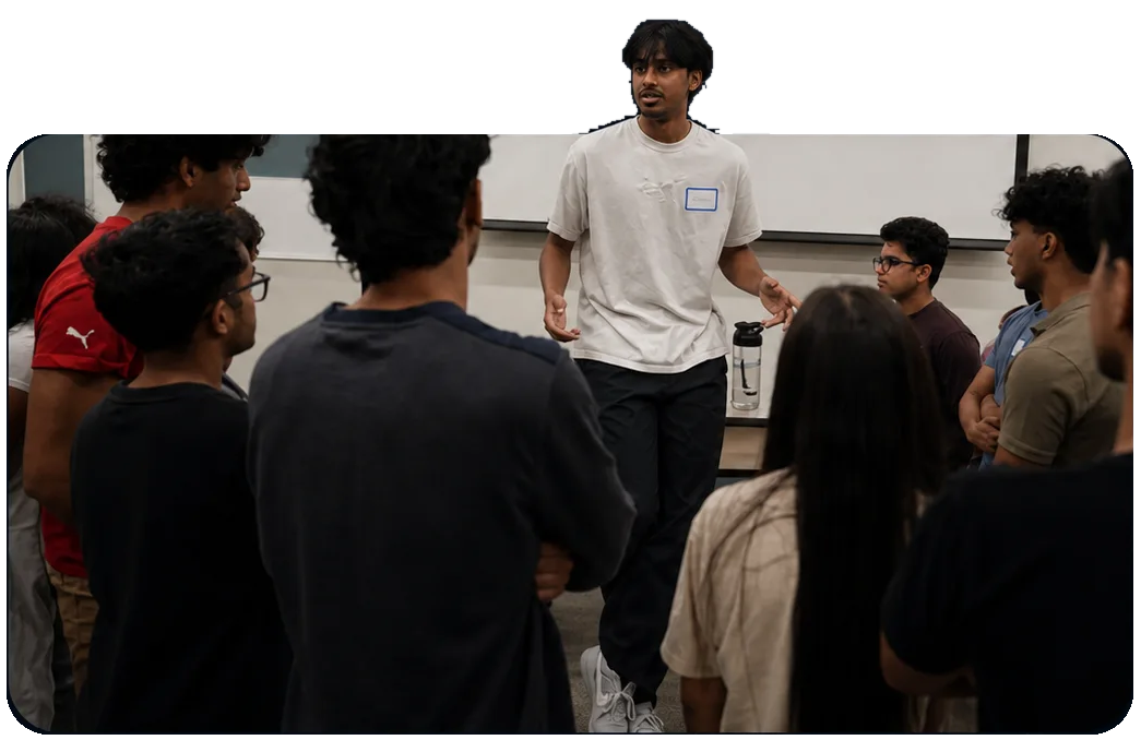 A KTP member leading a Purdue colony discussion among other students